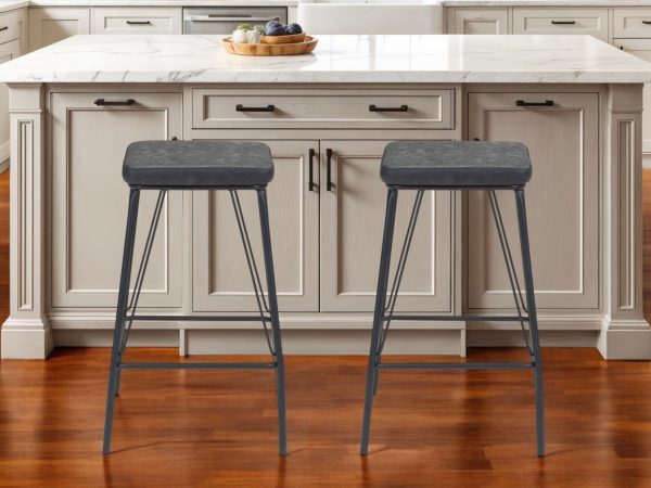Set of Two 26" Black Faux Leather And Steel Backless Counter Height Bar Chairs